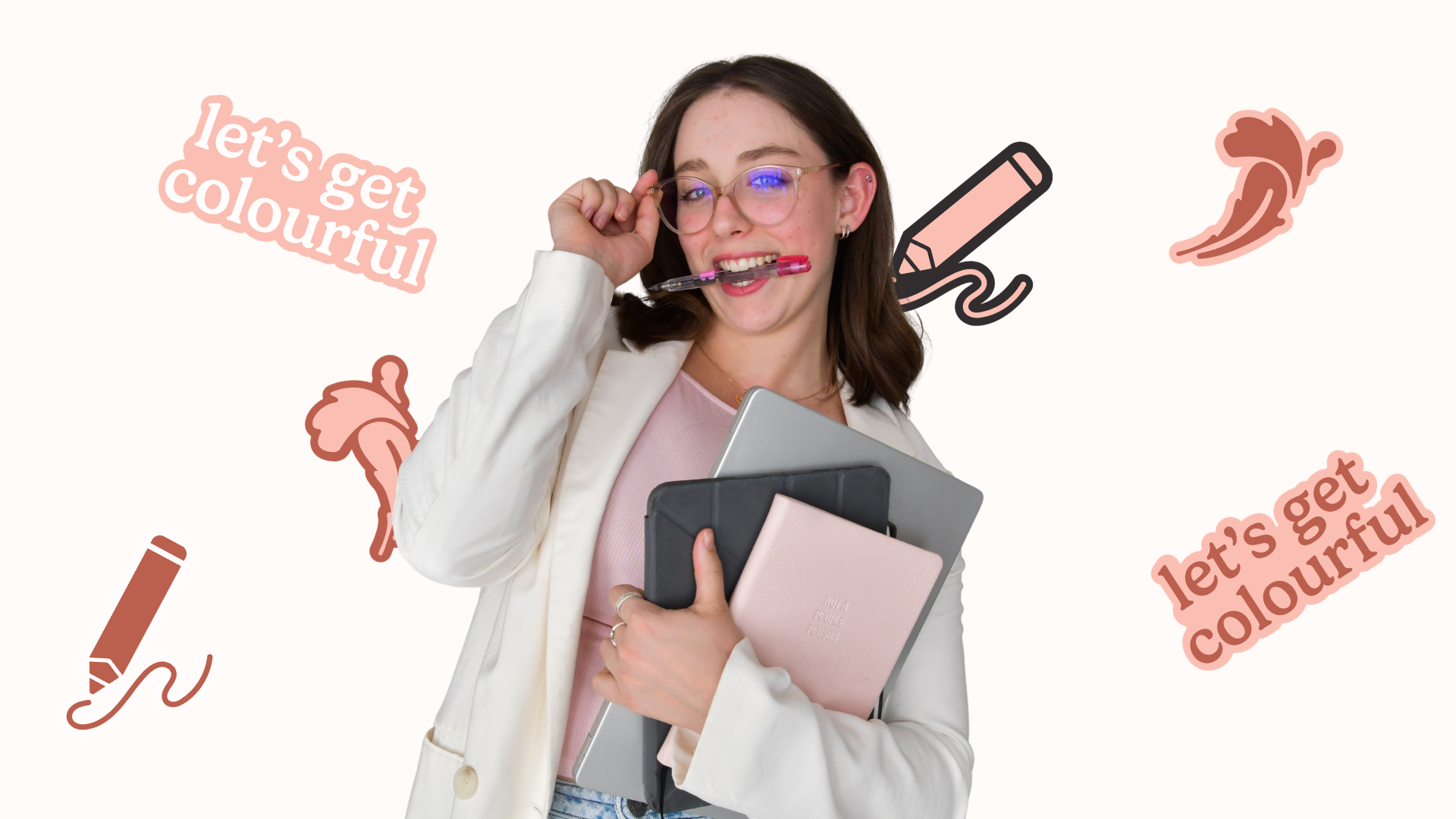 Graphic designer with books and pen